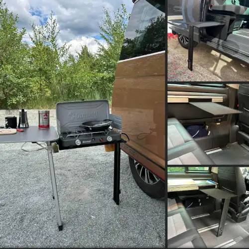 Extensión negra con una pata en una mesa exterior de una VW California